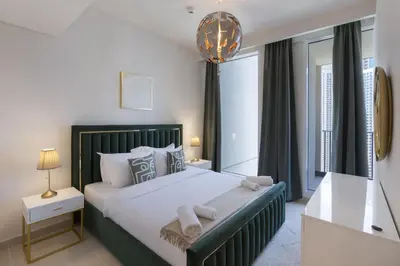 a bedroom with a large bed and a large window at Elegant 2 Bedroom Luxury Living in Harbour Gate - Allsopp&Allsopp in Dubai