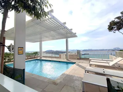 a swimming pool on top of a building at Seaside Serenity: 1-BR Apartment with Beach Access in Dubai
