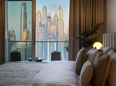 a bedroom with a large window with a view of a city at Breathtaking view studio – Address Dubai Marina in Dubai