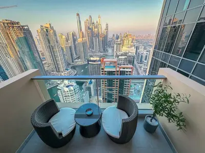 a balcony with a table and chairs on top of a building at Breathtaking view studio – Address Dubai Marina in Dubai