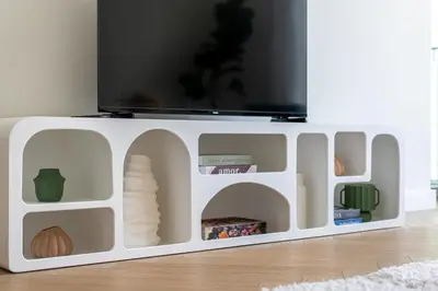 a white cabinet with a tv on top at TH-Homes Downtown 2 Bedroom with Burj Khalifa view in Dubai