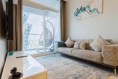 a living room with a couch and a large window at TURQUOISE - Downtown Dubai 1 BEDROOM APARTMENT Business Bay - CANAL VIEW in Dubai