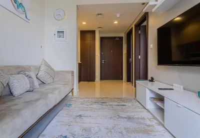 a living room with a couch and a flat screen tv at TURQUOISE - Downtown Dubai 1 BEDROOM APARTMENT Business Bay - CANAL VIEW in Dubai