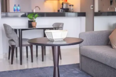 a table with a bowl on it next to a couch at Upscale 1 bed apartment in Business Bay-Suiteable in Dubai