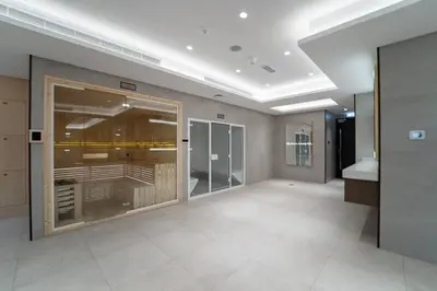 a large empty room with a large glass door at Romantic hideaway w breathtaking Burj Khalifa view in Dubai