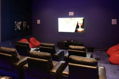 a waiting room with chairs and a flat screen tv at StoneTree - DAMAC Heights 1 BR - Amazing Facilities in Dubai