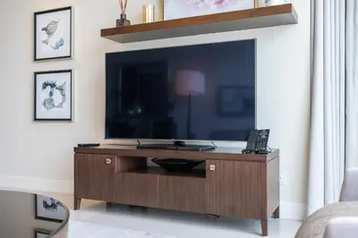 a living room with a large flat screen tv at New Listing - Serviced Apartment & TOP Amenities in Dubai